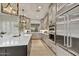 Modern kitchen featuring an oversized island, stainless steel appliances, ample counter space, and contemporary finishes at 7315 E Brisa Dr, Scottsdale, AZ 85266