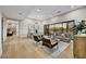 Spacious living area with hardwood floors, modern lighting, and views to the outdoors at 7315 E Brisa Dr, Scottsdale, AZ 85266
