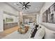 Bright living room features a stone fireplace, built-in cabinets, and an open floor plan at 7315 E Brisa Dr, Scottsdale, AZ 85266