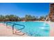 Expansive community pool with waterfall features and seating areas at 7315 E Brisa Dr, Scottsdale, AZ 85266