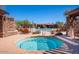 Inviting spa area near the pool, surrounded by decorative stonework and lounge chairs at 7315 E Brisa Dr, Scottsdale, AZ 85266
