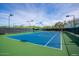 Well-maintained tennis court with bright blue surface and professional lighting at 7315 E Brisa Dr, Scottsdale, AZ 85266