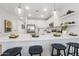 Open concept kitchen with a large center island, stainless steel appliances, and pendant lighting at 7439 S 76Th Dr, Laveen, AZ 85339