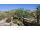 Relaxing backyard oasis with lush desert landscaping and a hammock, perfect for enjoying Arizona evenings at 7722 E Wolf Canyon St, Mesa, AZ 85207