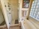 Relaxing bathroom features a glass-enclosed shower and soaking tub with natural light from glass block window at 7722 E Wolf Canyon St, Mesa, AZ 85207
