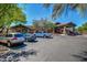 Clubhouse featuring covered entrance, ample parking, and lush landscaping, welcoming residents and guests at 7722 E Wolf Canyon St, Mesa, AZ 85207