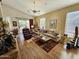 Bright living room features wood floors, comfortable furniture, and access to backyard patio at 7722 E Wolf Canyon St, Mesa, AZ 85207