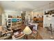 Open floor plan with kitchen and living room featuring wood floors and built in entertainment center at 7722 E Wolf Canyon St, Mesa, AZ 85207