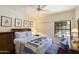 This cozy bedroom is bathed in natural light, featuring a comfortable queen bed and neutral decor with light-colored walls at 7955 E Chaparral Rd # 129, Scottsdale, AZ 85250