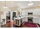 Modern kitchen with white cabinets, marble countertops, stainless steel appliances, and bar seating at 7955 E Chaparral Rd # 129, Scottsdale, AZ 85250
