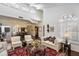 Spacious living room featuring high ceilings, a fireplace, and traditional furnishings at 7955 E Chaparral Rd # 129, Scottsdale, AZ 85250