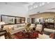 Elegant living room with a vaulted ceiling, fireplace, and sophisticated decor at 7955 E Chaparral Rd # 129, Scottsdale, AZ 85250