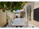 Charming outdoor patio with dining furniture, ideal for entertaining or relaxation, and a partially shaded area at 7955 E Chaparral Rd # 129, Scottsdale, AZ 85250