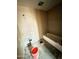 Bathroom featuring a standard bathtub, aged fixtures, partially repaired walls, and concrete flooring at 8257 E Cypress St, Scottsdale, AZ 85257