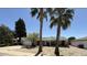 Traditional ranch home featuring desert landscaping and mature trees, perfect for outdoor living at 8257 E Cypress St, Scottsdale, AZ 85257