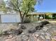 Charming single-story home with xeriscape landscaping and mature tree in front yard at 8257 E Cypress St, Scottsdale, AZ 85257