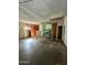 Interior of a garage with built-in shelving, storage cabinets, and concrete flooring, ready for customization at 8257 E Cypress St, Scottsdale, AZ 85257