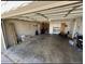 Spacious garage interior with an open door, ample storage, and concrete flooring, providing versatile space at 8257 E Cypress St, Scottsdale, AZ 85257
