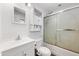 Clean bathroom featuring a modern vanity, toilet, and a shower with sliding glass doors at 9431 E Coralbell Ave # 192, Mesa, AZ 85208