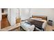 Cozy bedroom with a modern bed frame, and a glimpse into an adjacent bathroom at 9431 E Coralbell Ave # 192, Mesa, AZ 85208