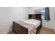 Cozy bedroom with a wood bedframe, carpeted floor, and natural light from the window at 9431 E Coralbell Ave # 192, Mesa, AZ 85208