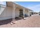 Inviting home exterior with a covered porch and manicured landscaping, with an arched entry at 9431 E Coralbell Ave # 192, Mesa, AZ 85208