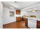 Kitchen with wood floors, cabinets, light countertops, and an open view to the living room at 9431 E Coralbell Ave # 192, Mesa, AZ 85208