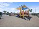 Community playground area with play structure, bench, and shade at 9431 E Coralbell Ave # 192, Mesa, AZ 85208