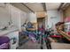 Image of a cluttered storage area with laundry hookups and an adjacent storage space at 9431 E Coralbell Ave # 192, Mesa, AZ 85208