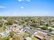 This aerial view captures the neighborhood with its well-kept lawns and proximity to community pool at 1050 W 9Th Pl, Mesa, AZ 85201