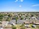 This aerial view shows the charming neighborhood with tree-lined streets and well-kept homes at 1050 W 9Th Pl, Mesa, AZ 85201