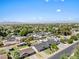 This aerial shows a neighborhood with mature trees, well-maintained lawns, and access to city amenities at 1050 W 9Th Pl, Mesa, AZ 85201