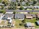 Aerial view of single Gathering home featuring backyard with lawn and storage building at 1050 W 9Th Pl, Mesa, AZ 85201