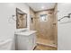 Beautiful bathroom featuring a tiled shower, vanity with white marble top, and modern fixtures at 1050 W 9Th Pl, Mesa, AZ 85201