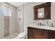 Bathroom with a vanity, shower, and modern fixtures at 1050 W 9Th Pl, Mesa, AZ 85201