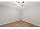 Bright bedroom featuring wood floors, ceiling fan, and ample natural light at 1050 W 9Th Pl, Mesa, AZ 85201
