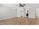 Bright bedroom with a ceiling fan and wood-look tile flooring at 1050 W 9Th Pl, Mesa, AZ 85201