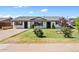 Charming single-story home boasting a well-maintained lawn and inviting curb appeal at 1050 W 9Th Pl, Mesa, AZ 85201