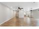 Spacious living area with wood-look floors, barn door and open access to kitchen at 1050 W 9Th Pl, Mesa, AZ 85201
