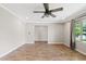 Open living room features wood-look floors, recessed lighting, and a ceiling fan at 1050 W 9Th Pl, Mesa, AZ 85201