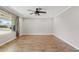 Spacious living room with natural light, wood-look floors, and neutral paint at 1050 W 9Th Pl, Mesa, AZ 85201
