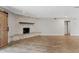 Bright living room with a fireplace and a sliding barn door at 1050 W 9Th Pl, Mesa, AZ 85201