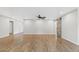 Large open-concept living area with wood-look floors and modern sliding barn door at 1050 W 9Th Pl, Mesa, AZ 85201