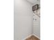 Functional utility area showcasing modern water heater and connections for laundry appliances at 1050 W 9Th Pl, Mesa, AZ 85201