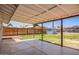 A covered back patio with a concrete surface overlooks the grassy backyard and fenced perimeter at 1058 E 2Nd St, Mesa, AZ 85203