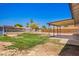 A wide backyard features grass, a shed, and a covered patio perfect for outdoor activities at 1058 E 2Nd St, Mesa, AZ 85203