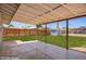 Covered patio with a view of the grassy backyard and storage shed at 1058 E 2Nd St, Mesa, AZ 85203