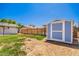 The backyard features a shed, lawn and a perimeter fence offering privacy and storage at 1058 E 2Nd St, Mesa, AZ 85203