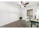 Bright bedroom with a ceiling fan, closet, and neutral carpet at 1058 E 2Nd St, Mesa, AZ 85203