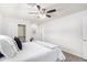 Bright bedroom featuring a closet, a ceiling fan, and cozy decor at 1058 E 2Nd St, Mesa, AZ 85203